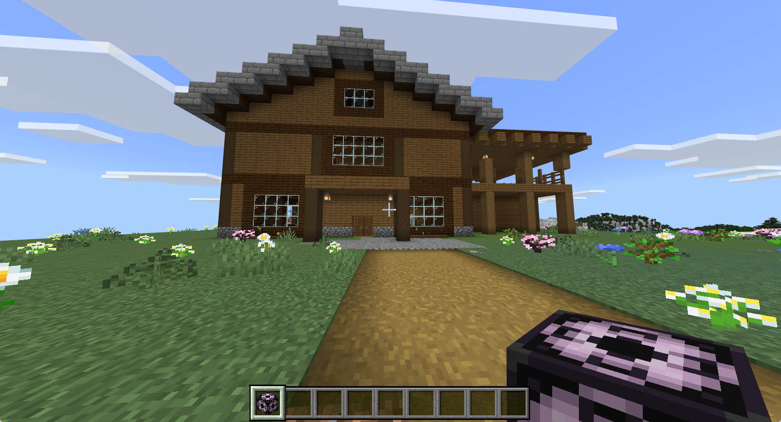 The cottage appears in the Bedrock world after the structure block loads it